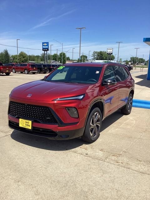 2025 Buick Enclave Sport Touring in Cherry Red Tintcoat — front three-quarter view